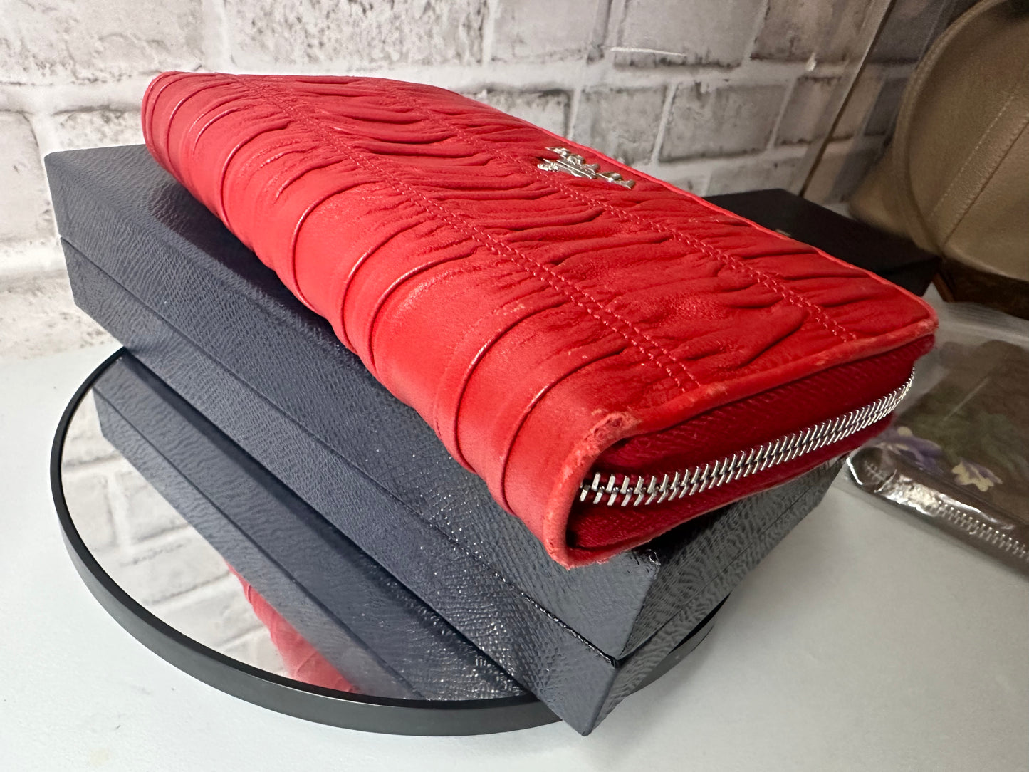 Prada Red Nappa Gaufre Leather Continental
Wallet Silvertone Hardware Zippered CLosure