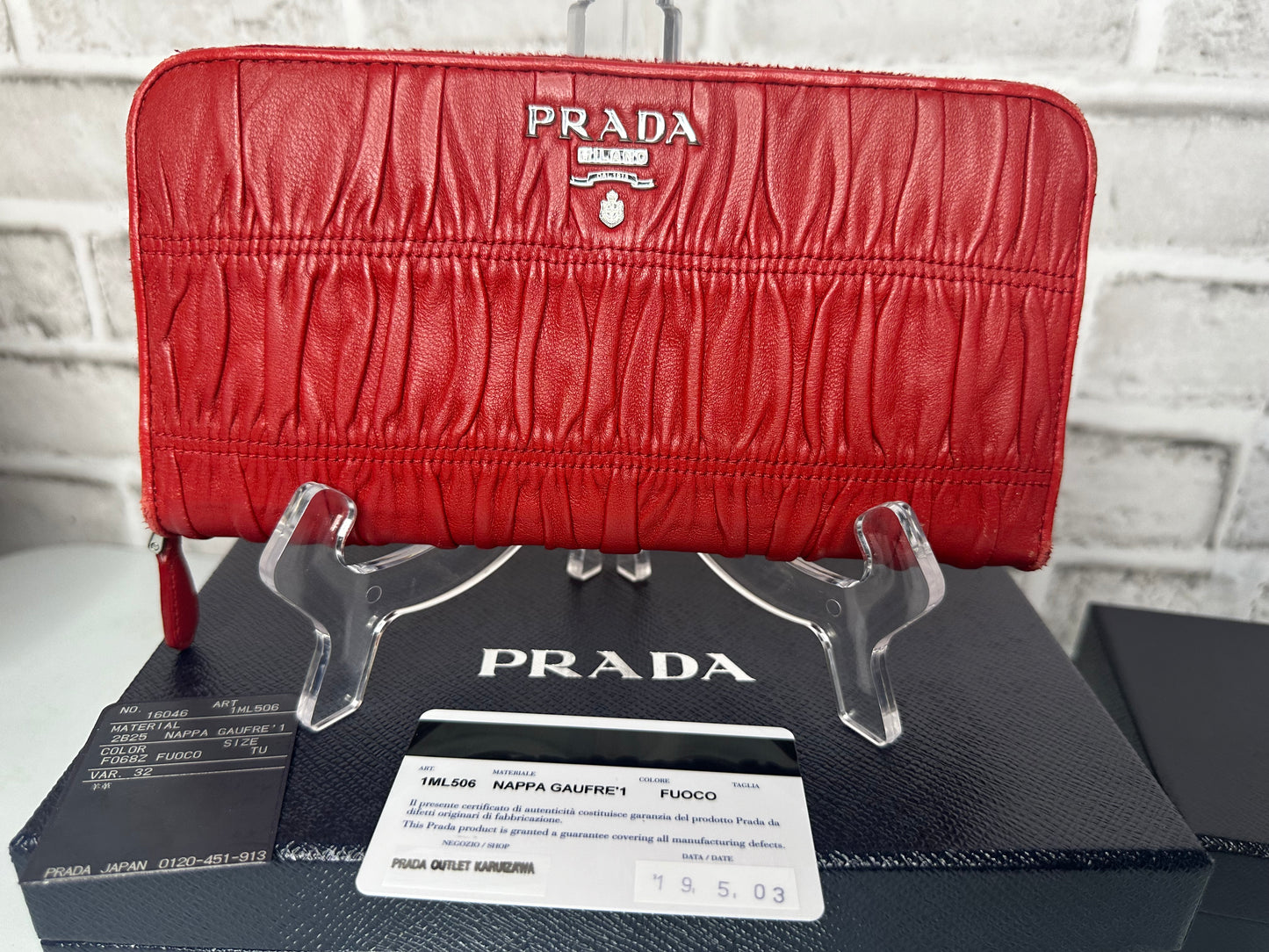 Prada Red Nappa Gaufre Leather Continental
Wallet Silvertone Hardware Zippered CLosure